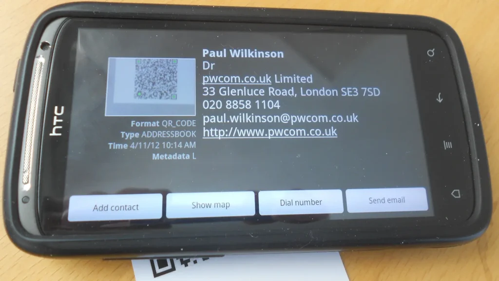 A professional's details revealed on a smartphone after a QR code was scanned.. 