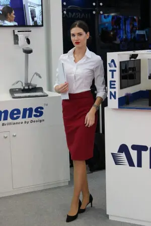 A woman in a white shirt and red skirt.