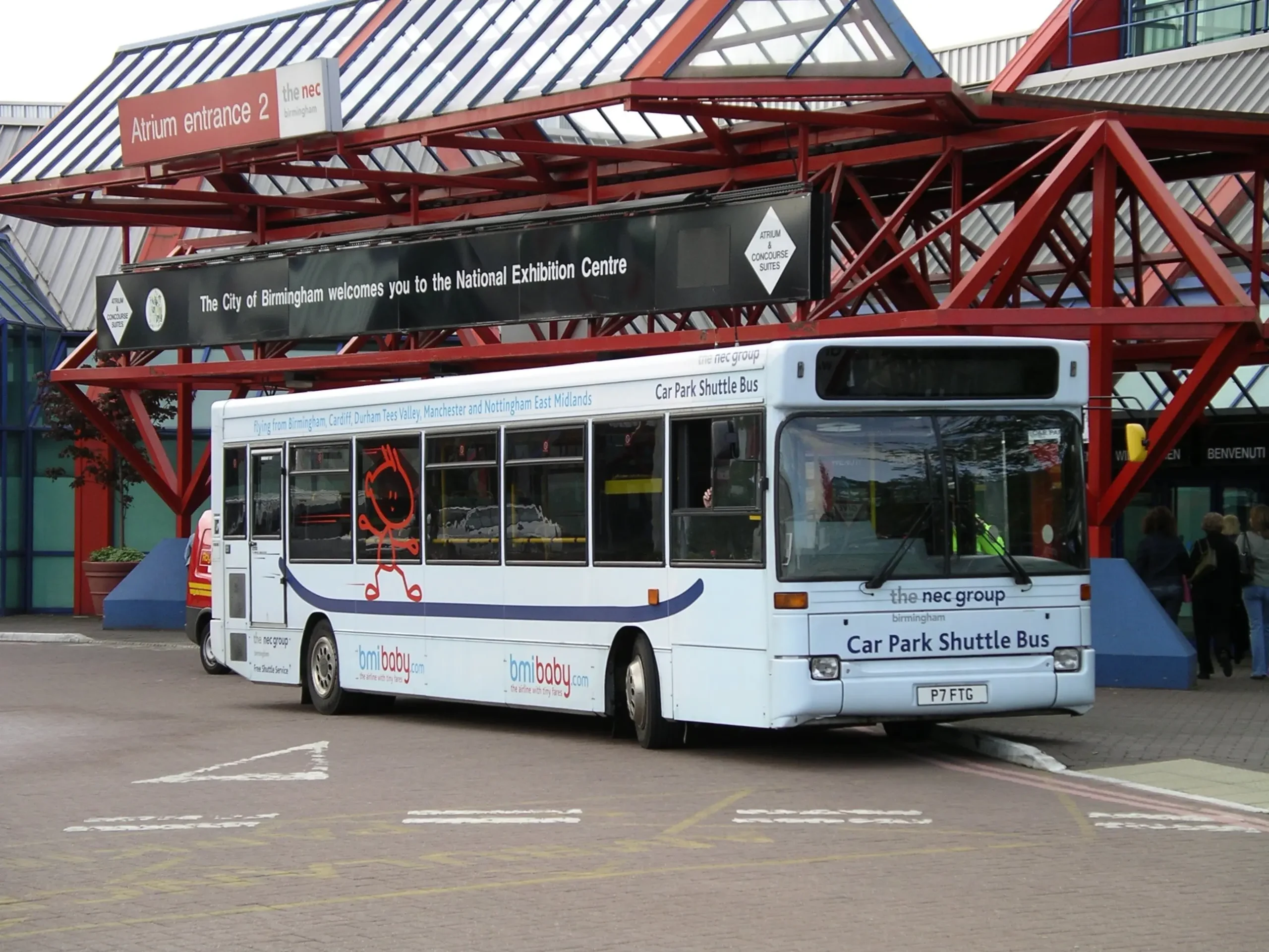 NEC shuttle bus picking up passengers outside the exhibition centre. 