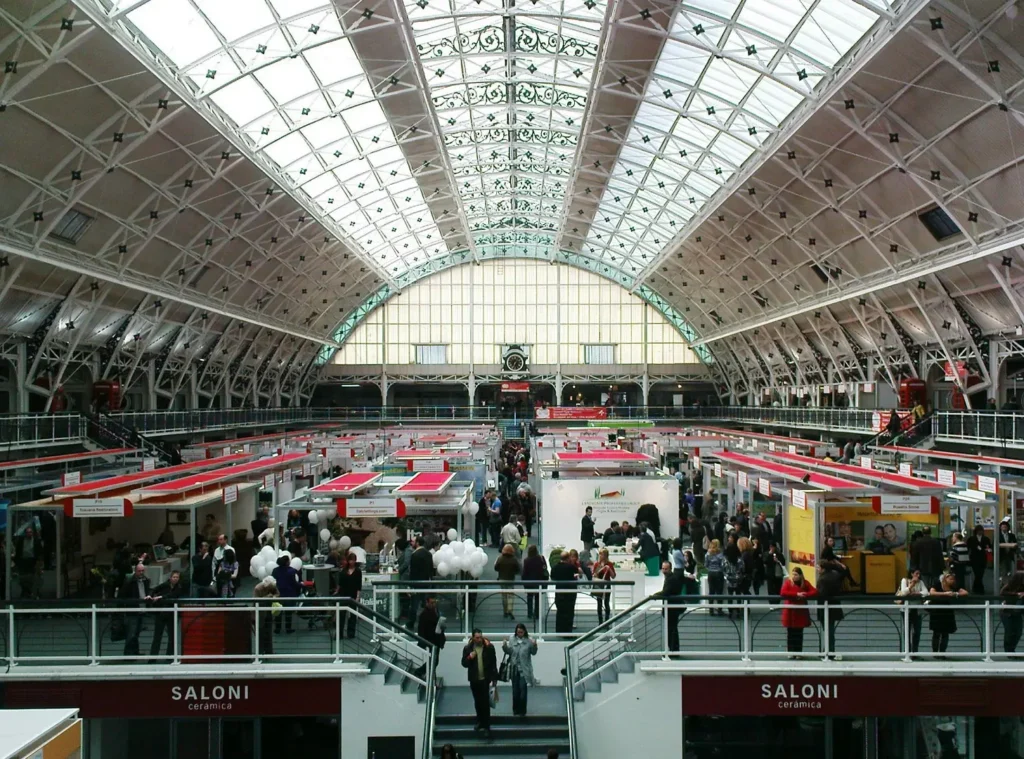 Interior of the London Business Design Centre during a busy exhibition event.