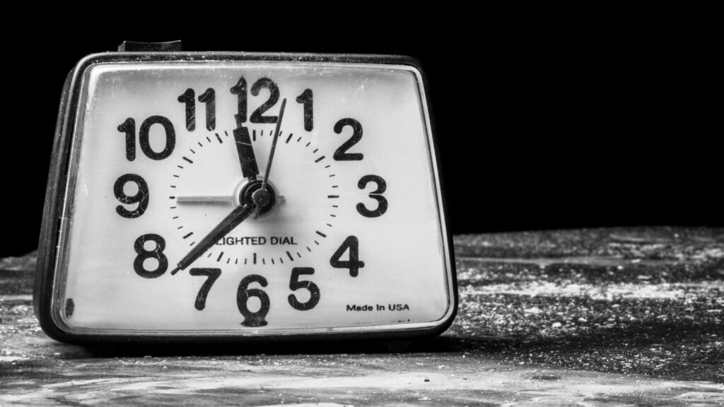 Vintage alarm clock on a table.