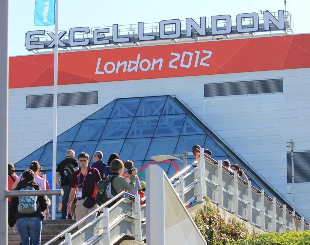 The ExCeL London building in 2012 with a promotional banner for the London Olympics. 