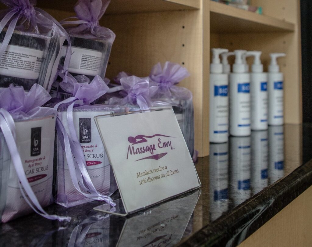 A display of body scrub and massage gift sets. 