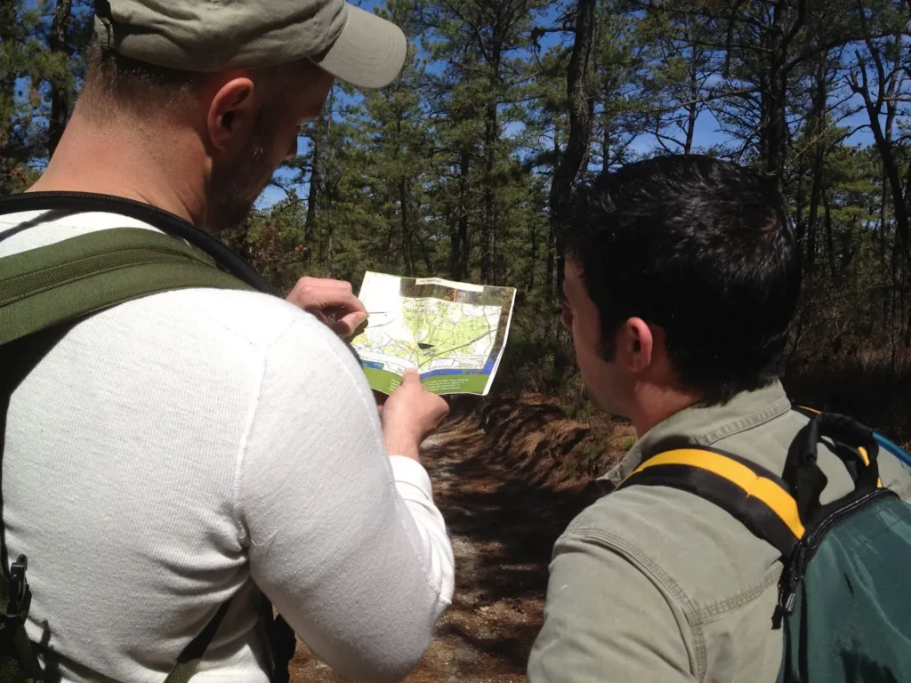 Two hikers looking at a map.
