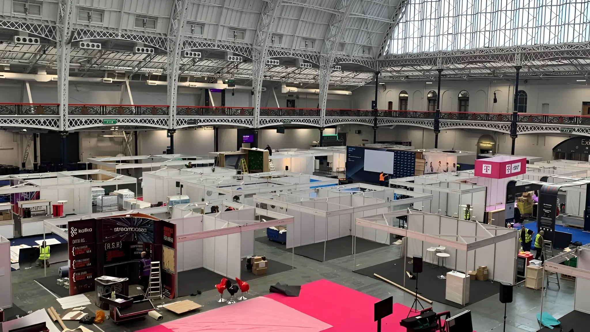 Exhibition stands being built at the IOT Tech Expo Global at the London Olympia.