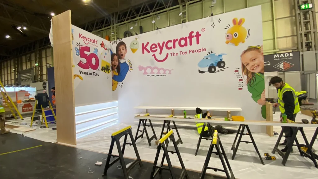 Workers assemble Keycraft's exhibition stand at Spring Fair 2025, designed and built by Booth Exhibits™.