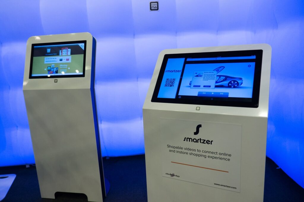 Touchscreen pay points shown at the Retail Technology Show exhibition.