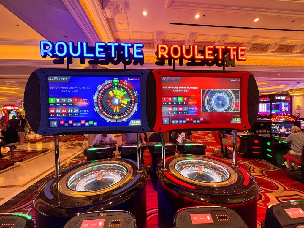 One blue and one red roulette machine of the same type. 