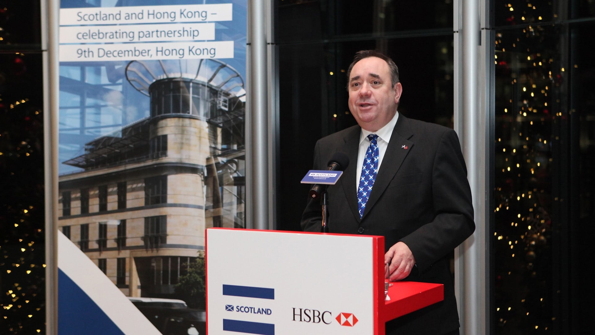 A man speaking at a business partnership event in Scotland.