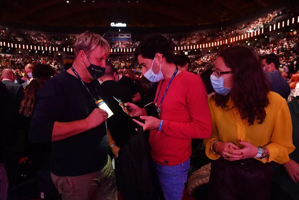A trade show attendee gets his visitor pass scanned digitally.