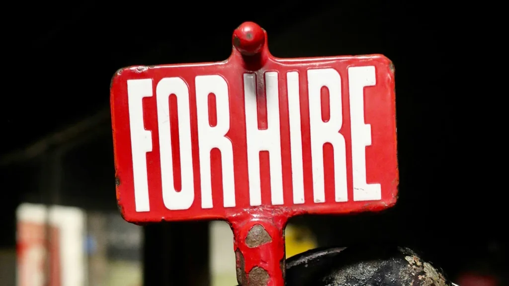 A red sign saying "for hire".